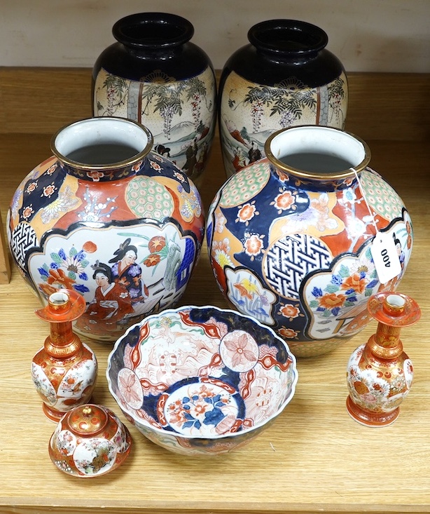 Japanese Kutani, Satsuma and Imari; four vases, a bowl, a pair of candlesticks and a pot (8). Condition - candle sticks damaged